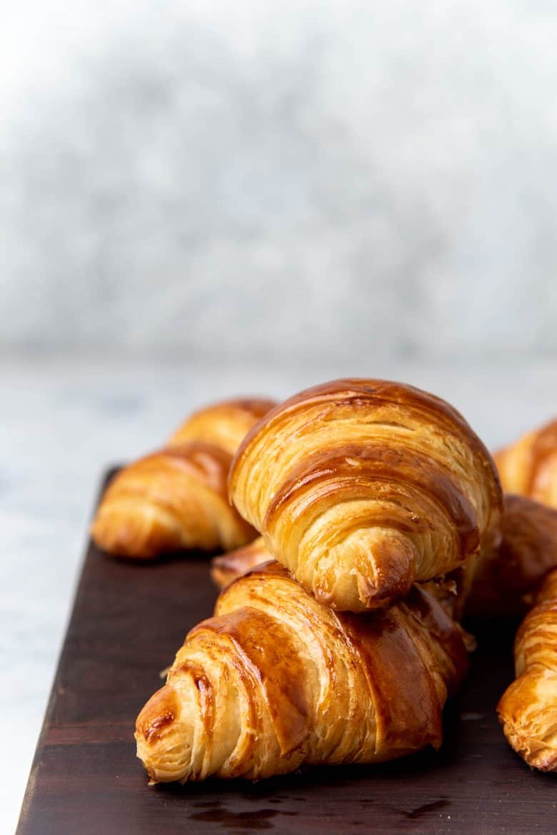 Croissants served on a wooden block