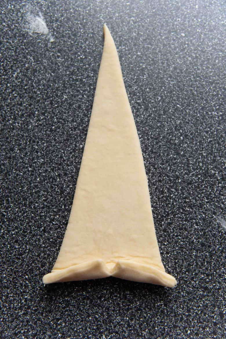 Rolling up the croissant dough