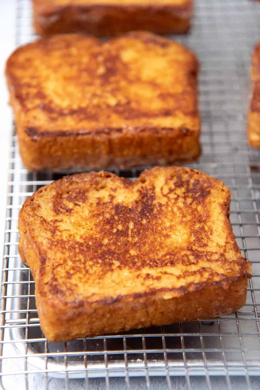 Freshly made toast on a wire rack