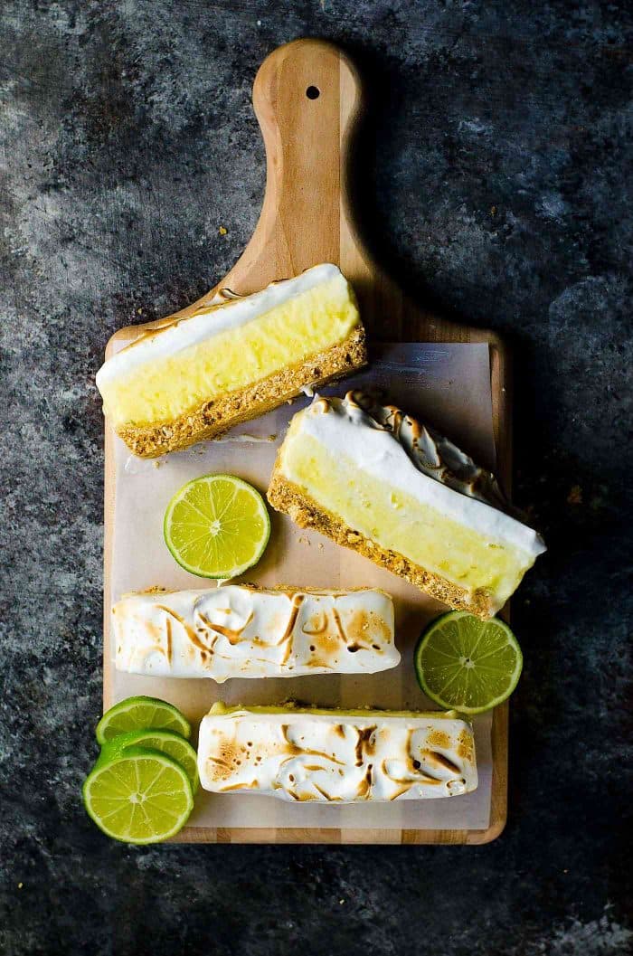 No Bake Frozen Margarita Pie Slice with a Pretzel crust - A boozy and refreshing summer dessert with perfectly balanced sweet, tart and salty flavors. Made with lime curd, and tequila this is a cocktail, a dessert and a summer fiesta in one glorious frozen margarita pie slice! And it's deceptively easy to make too!
