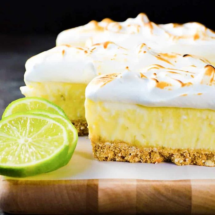 No Bake Frozen Margarita Pie Slice with a Pretzel crust - A boozy and refreshing summer dessert with perfectly balanced sweet, tart and salty flavors. Made with lime curd, and tequila this is a cocktail, a dessert and a summer fiesta in one glorious frozen margarita pie slice! And it's deceptively easy to make too!