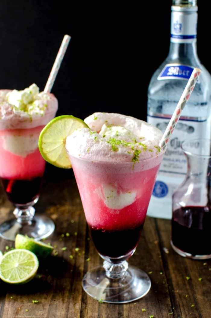 Hibiscus Strawberry Margarita Ice Cream Float - Take your Margaritas to the next level with this simple and delicious twist! Sweetened with a Hibiscus and Strawberry Syrup, plus tequila and a generous scoop of Salted Lime Sherbet this Ice Cream float is the PERFECT treat for Cinco de Mayo or any party! REPIN to save. CLICK to get the recipe! #TheFlavorBender