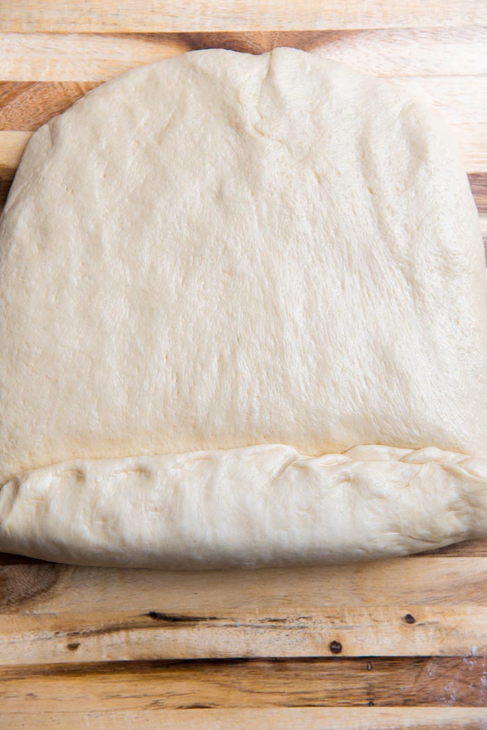 Roll up the dough, while pressing it into the dough, as you roll it up.