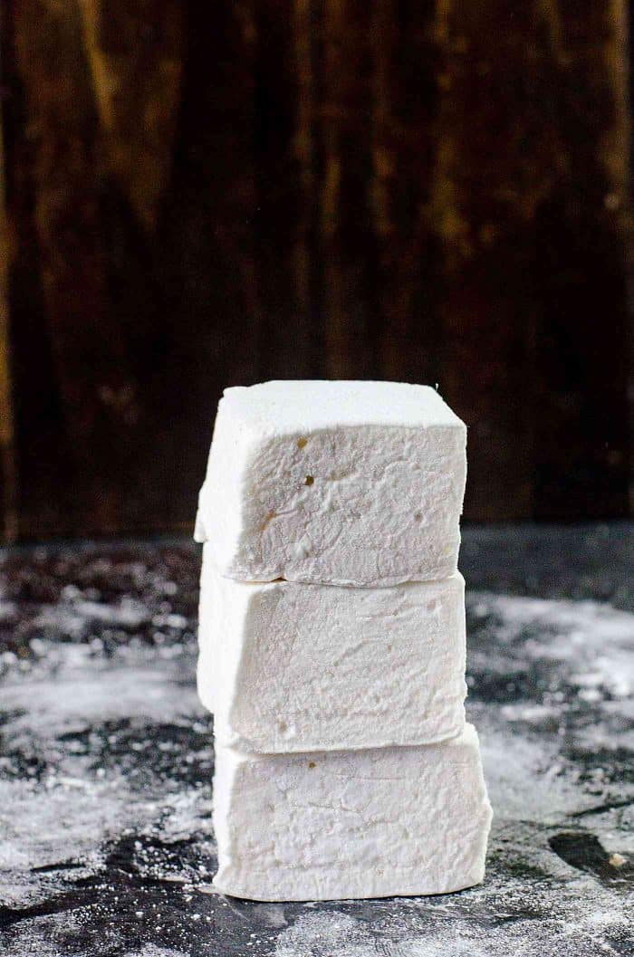 How to make marshmallows - homemade marshmallows stacked on top of each other.