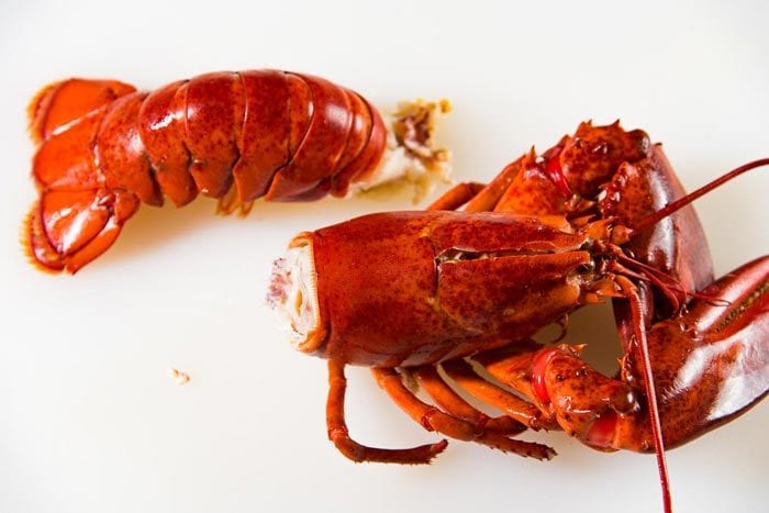A separated lobster body and lobster tail