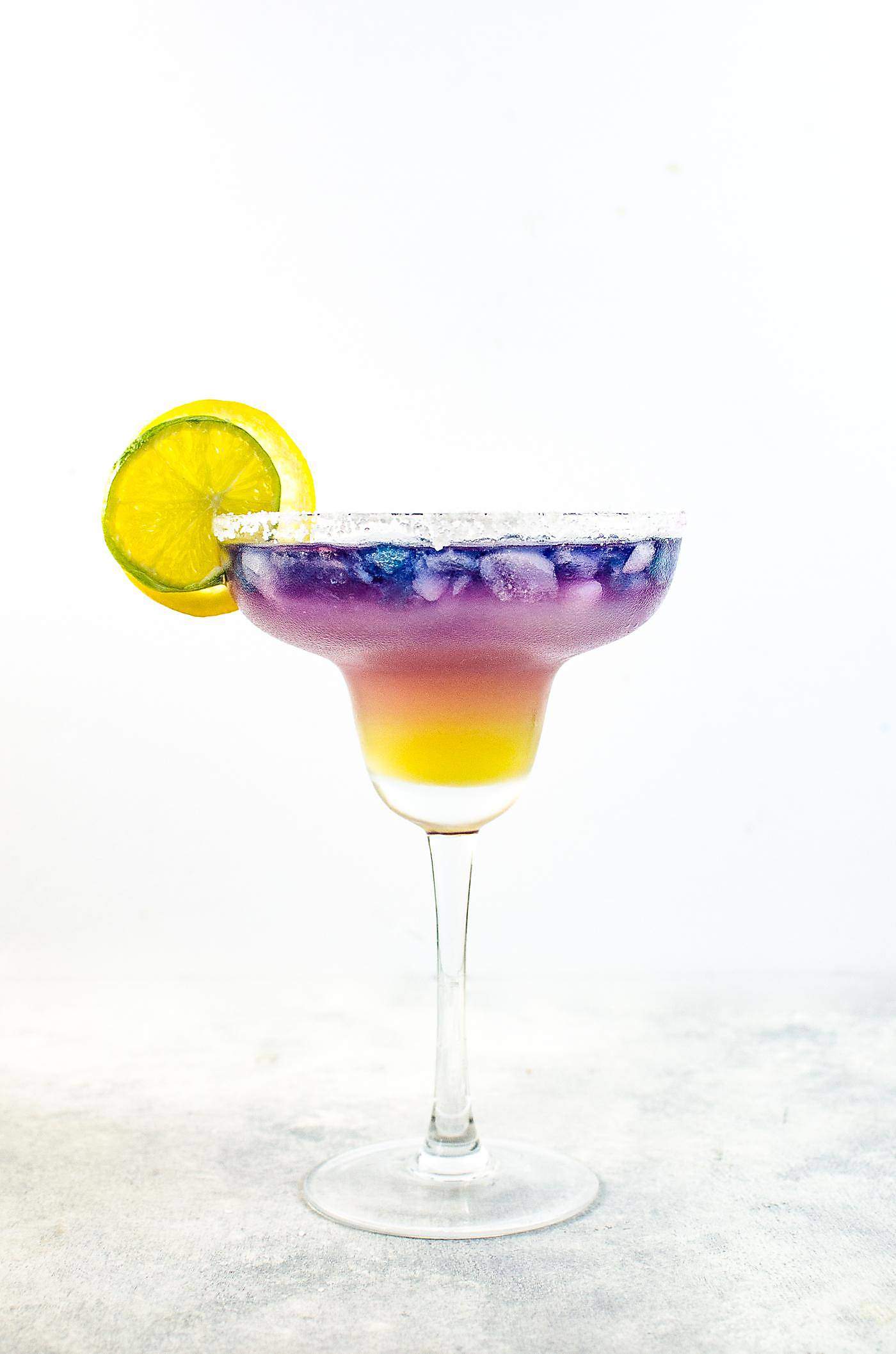 Magical Color Changing Cocktails (Galaxy Cocktails) - Color Changing Sunset Margarita - Four incredible Magical Cocktails to make and be inspired to make your own! Wow your friends and family with these fun and unique cocktails made with color changing alcohol. 