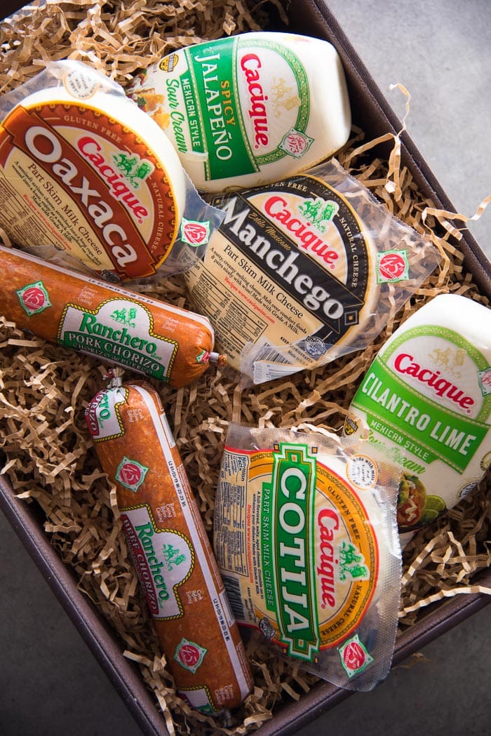 All Cacique products placed in a tray, from cheeses to meat products.