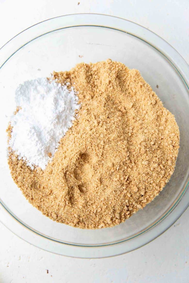 Crushed graham cracker crumbs and sugar in a bowl