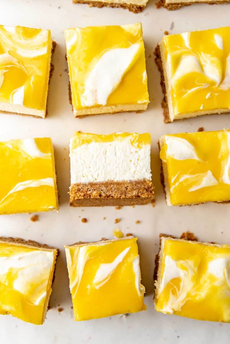 Swirled lemon cheesecake, overhead view with one slice on its side