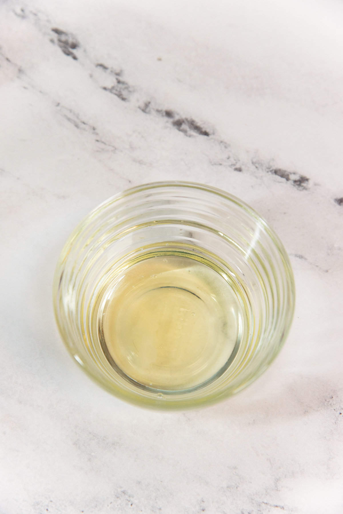 The small bowl containing the freshly separated egg white.