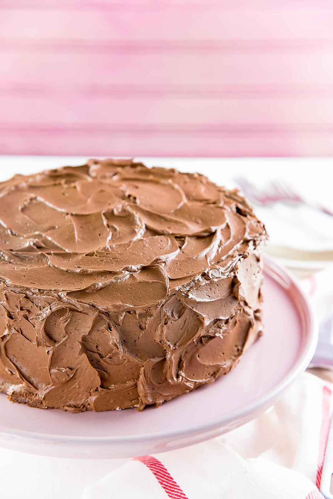 The Best Vanilla Cake - A vanilla cake with swirls of creamy chocolate frosting. Swirl the frosting for an old fashioned home-made look, OR smooth out the sides for a sleek look.