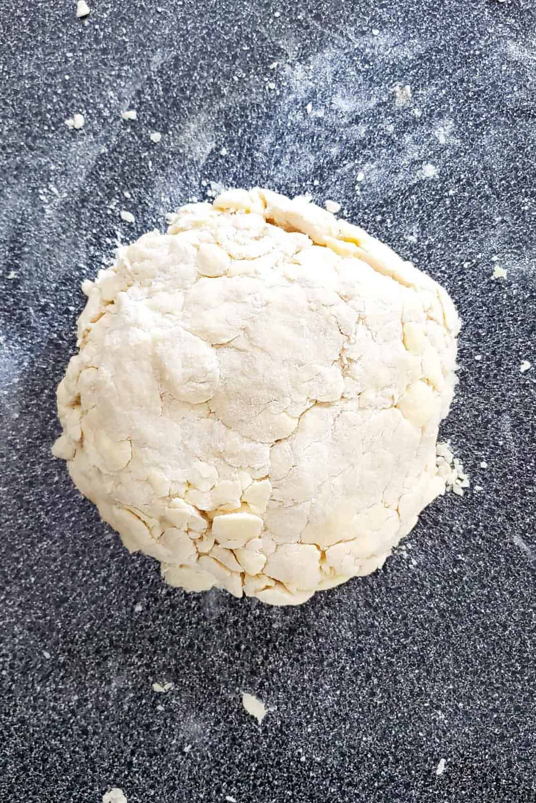 The pie dough after being stacked and shaped.