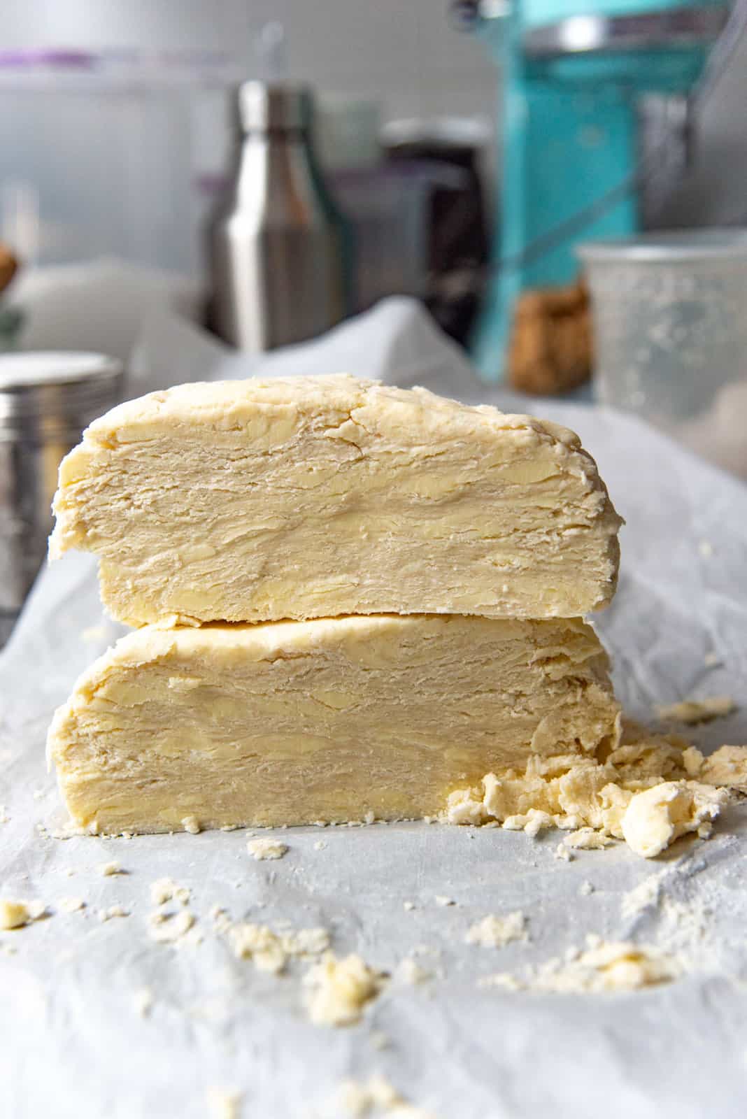 The pie dough cut into half and stacked, to show the layers the butter has formed.