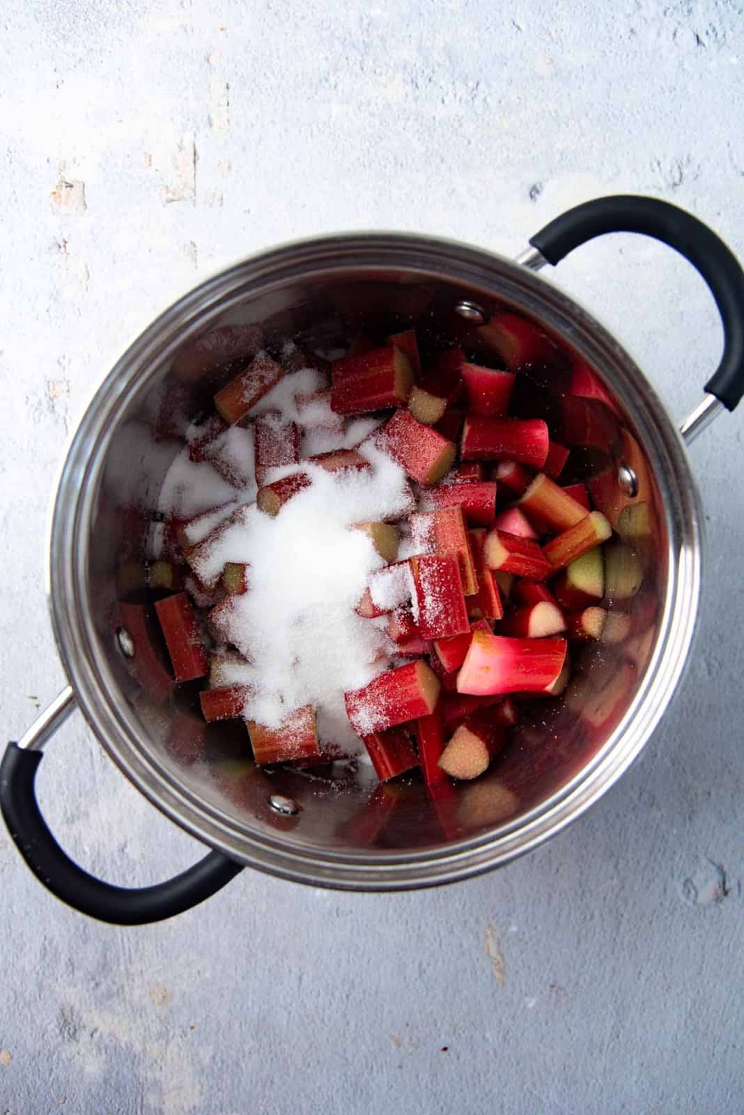 Rhubarb and sugar in a pot.