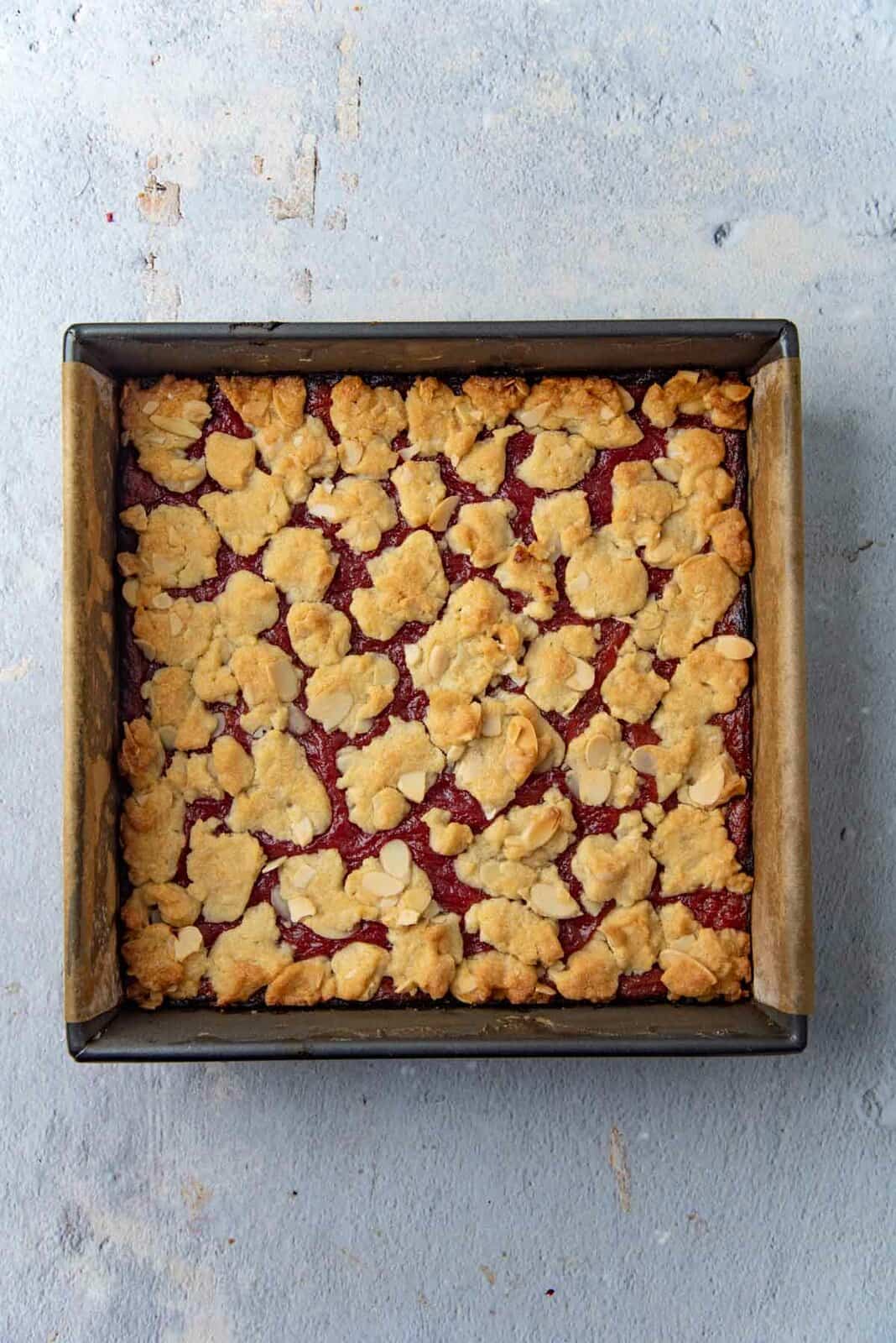 Freshly baked rhubarb bars with golden crumble topping.
