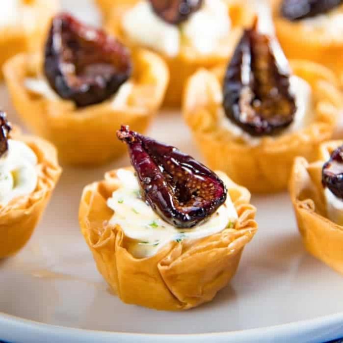 Goat Cheese and Roasted Fig Tartlet - Sweet, savory, creamy and crunchy all in one bite. These appetizers can be made a few days ahead of time, and the recipe is also very adaptable.
