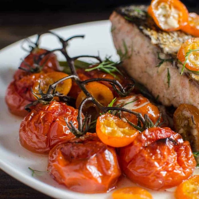 Brown Butter Roasted Tomatoes, Asparagus and Kumquats - This vegetable side dish is simple and easy to make, but has big flavors! From the roasted kumqauts to the brown butter to the roasted garlic! Perfect with Salmon (or any fish), or meat!