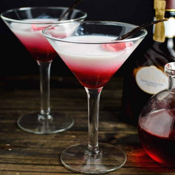 Vanilla Rose and White Chocolate Cocktail - This cocktail is one delicious, sweet decadent cocktail with beautiful floral flavours and a spectacular look! An inspired Falooda Cocktail with exotic flavours and an edible floral decoration! REPIN to save! CLICK to get the recipe now. #TheFlavorBender