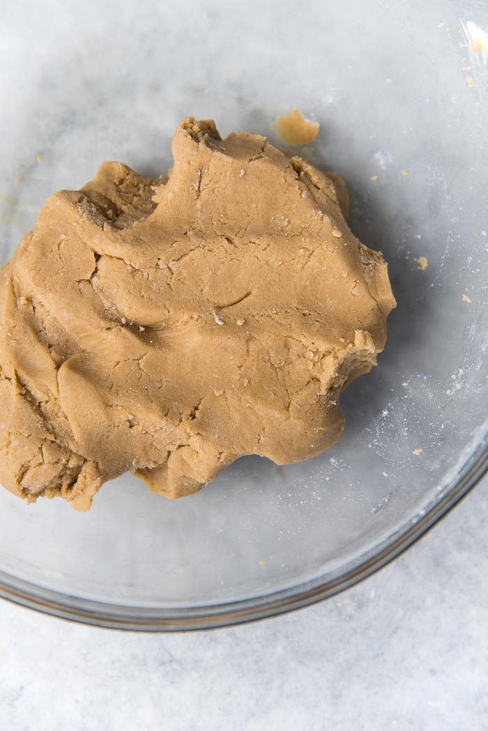 Making Craqueline for choux au craqueline - Bring the crumbles together to make a cohesive dough.