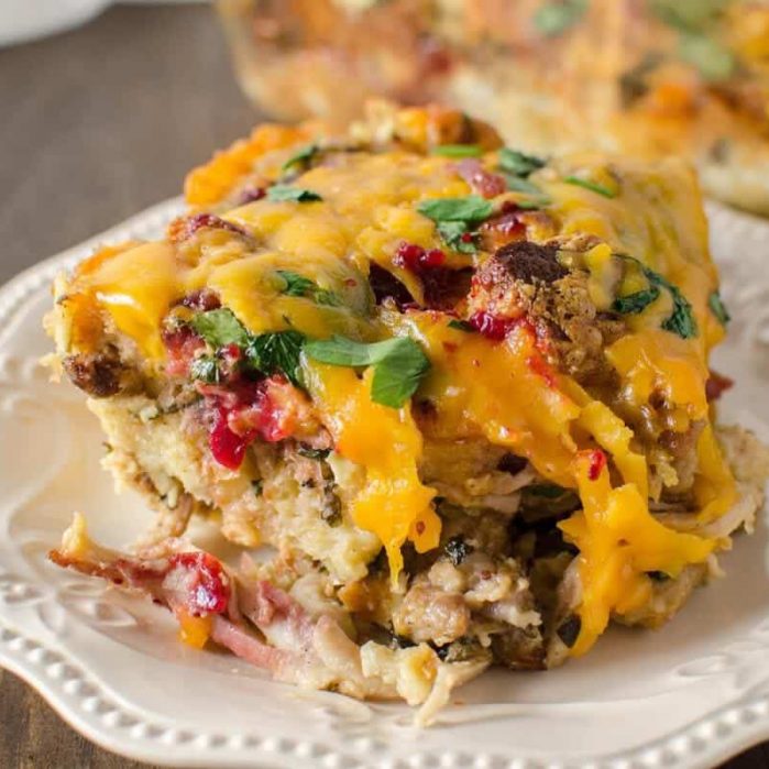 Thanksgiving Leftover Savory Bread Pudding packed with juicy leftover turkey, stuffing and cranberry sauce and topped with cheese - you will make sure you have leftovers JUST so you can have Thanksgiving in the morning too!