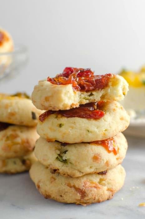 Savory Cheese Thumbprint Cookies with Bourbon Tomato Jam - These savory cookies are the NEXT BEST THING! Buttery, herby cookies with delicious cheddar cheese, and an amazing tomato jam! Comes together easily and its PERFECT as an appetizer, party food, or as a snack!