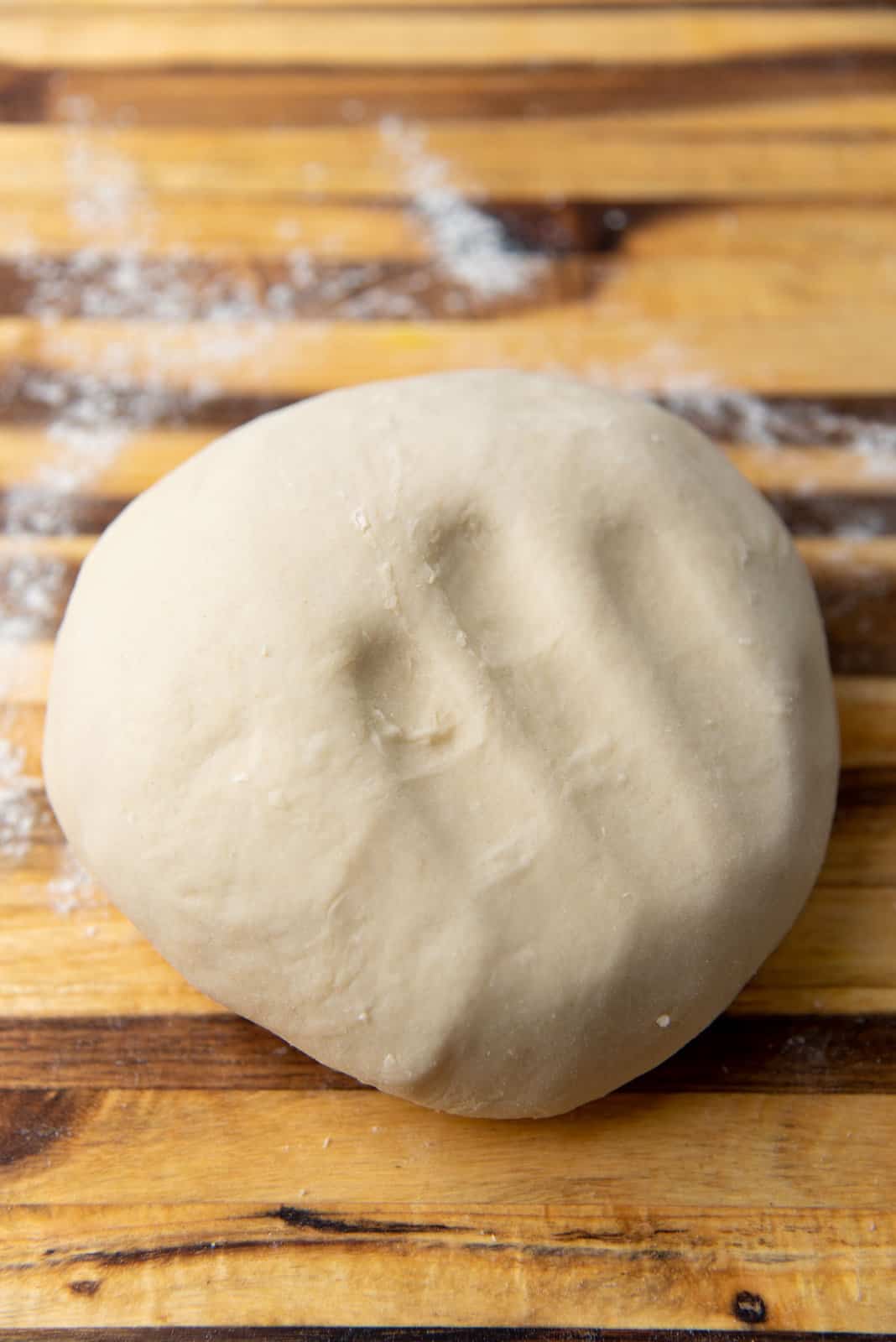A hand imprint left on the dough to show the softness of the dough.