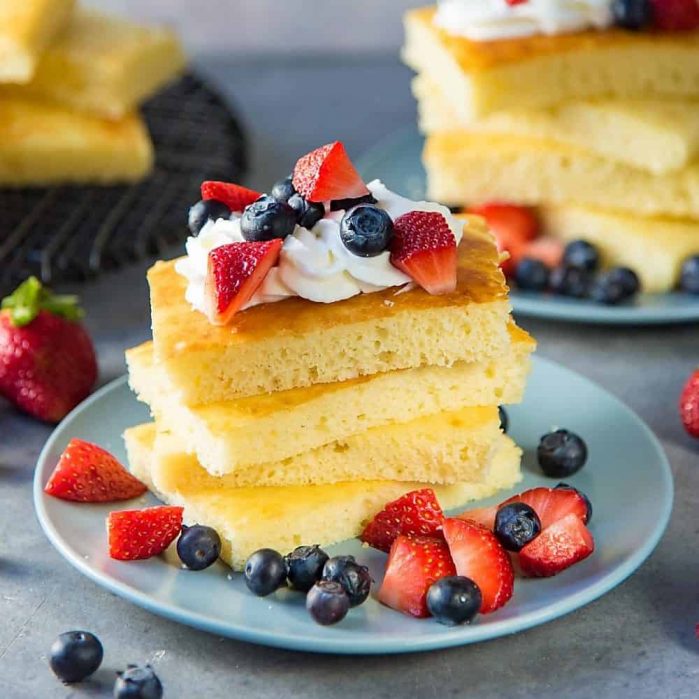 Sheet pan pancakes - Soft light and fluffy oven baked pancakes for breakfast or brunch. Perfect for a crowd, and easy to make. 
