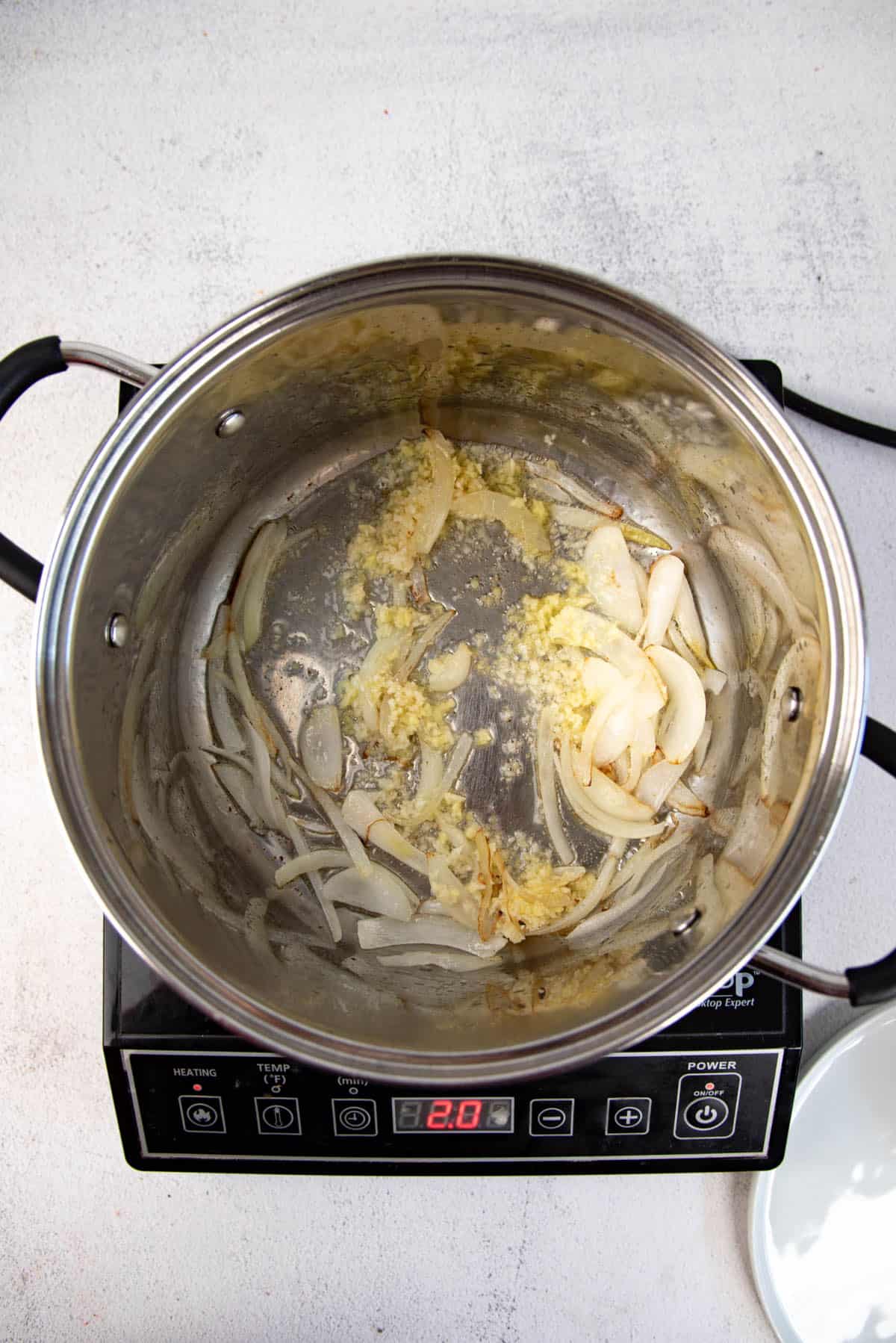 Adding garlic and ginger to softened and slightly caramelized onion.