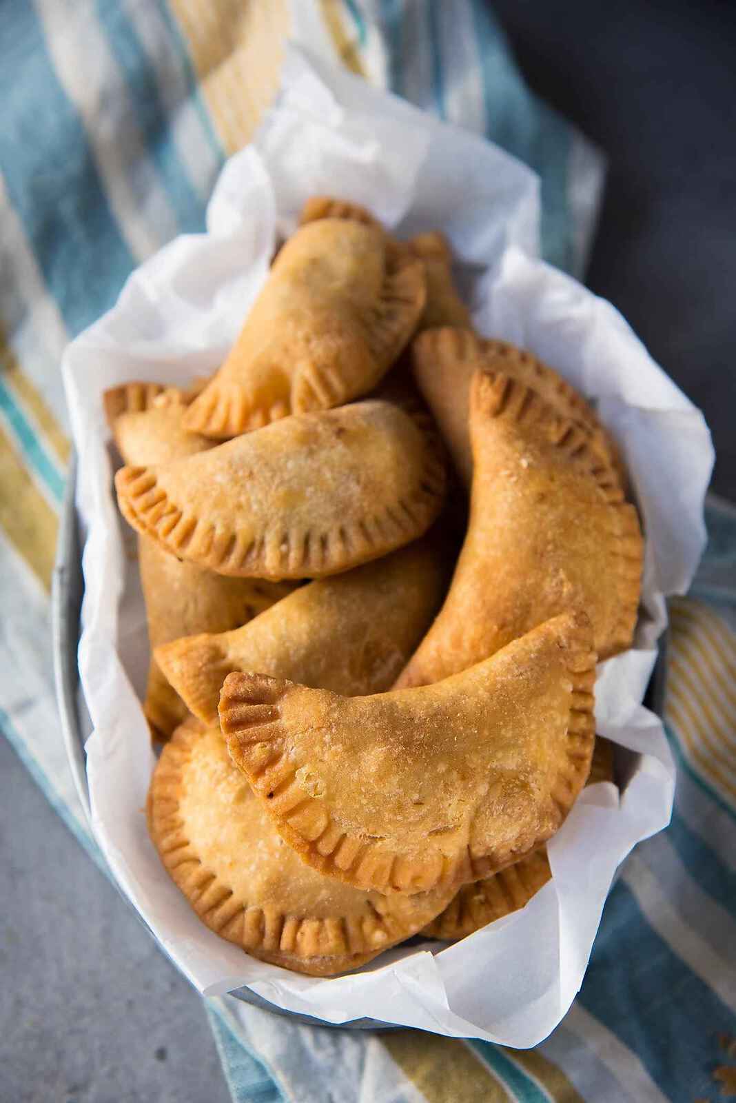 Sri Lankan Fish Patties - These fish empanadas are epic! A spicy fish filling inside perfectly flaky buttery crust. Perfect for snacking. Step by step instructions to make these Sri Lankan Patties. Freezer friendly too.