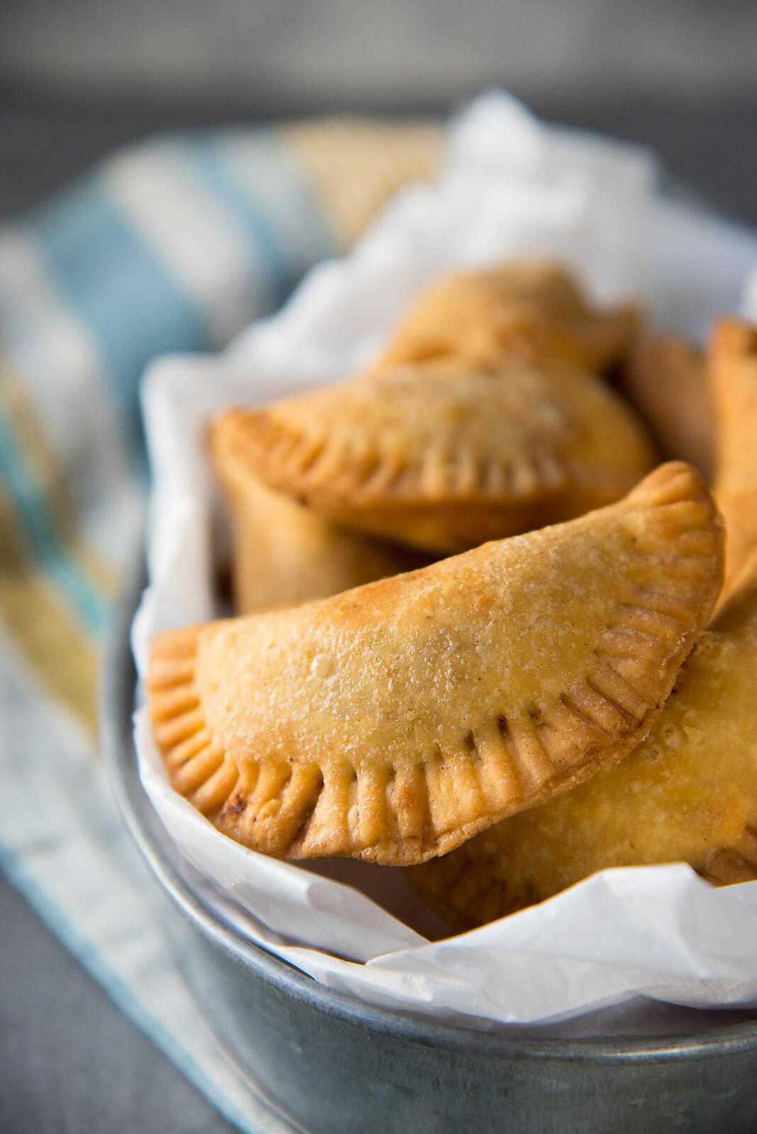 Sri Lankan Fish Patties - These fish empanadas are epic! A spicy fish filling inside perfectly flaky buttery crust. Perfect for snacking. Step by step instructions to make these Sri Lankan Patties. Freezer friendly too.