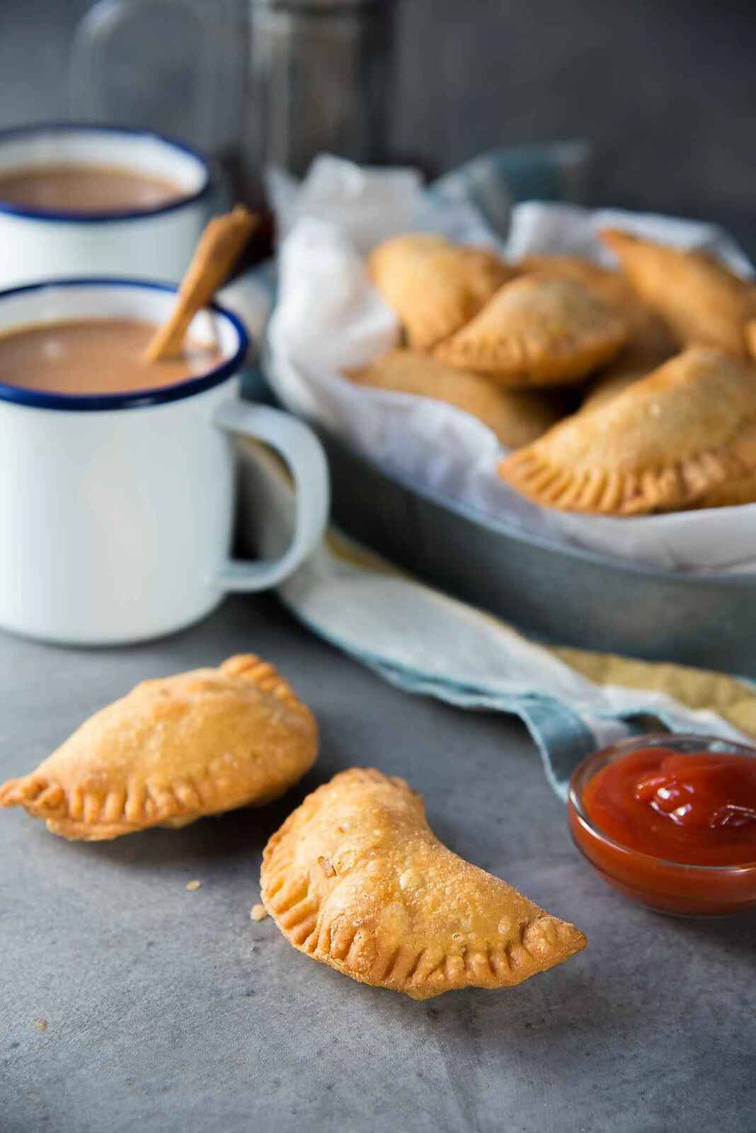 Sri Lankan Fish Patties - These fish empanadas are epic! A spicy fish filling inside perfectly flaky buttery crust. Perfect for snacking. Step by step instructions to make these Sri Lankan Patties.