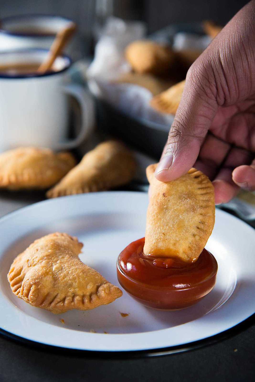 Sri Lankan Fish Patties - These fish empanadas are epic! A spicy fish filling inside perfectly flaky buttery crust. Perfect for snacking. Step by step instructions to make these Sri Lankan Patties. Perfect with tomato sauce or chili sauce.