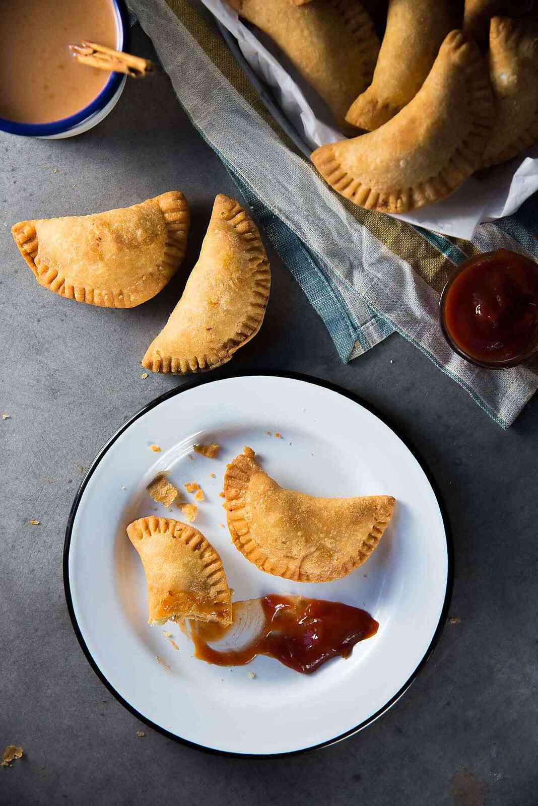 Sri Lankan Fish Patties - These fish empanadas are epic! A spicy fish filling inside perfectly flaky buttery crust. Perfect for snacking. Step by step instructions to make these Sri Lankan Patties