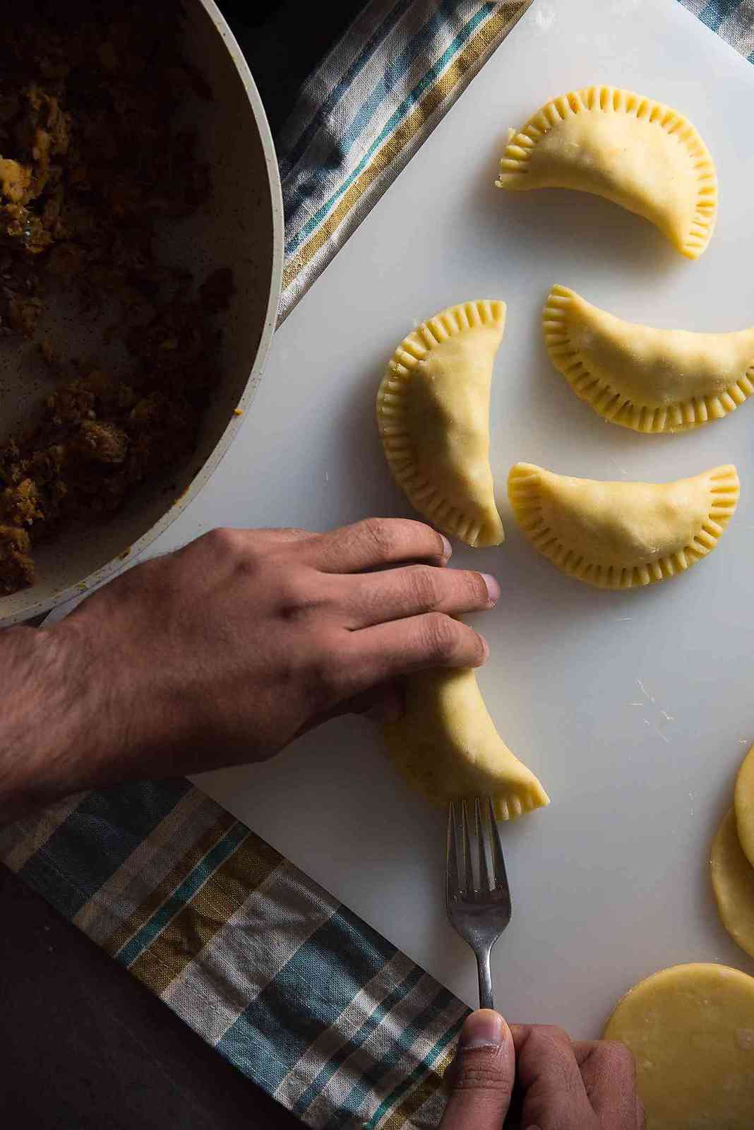 Sri Lankan fish patties - Seal the pastry edges with water and use a fork to crimp the edges to seal it properly.
