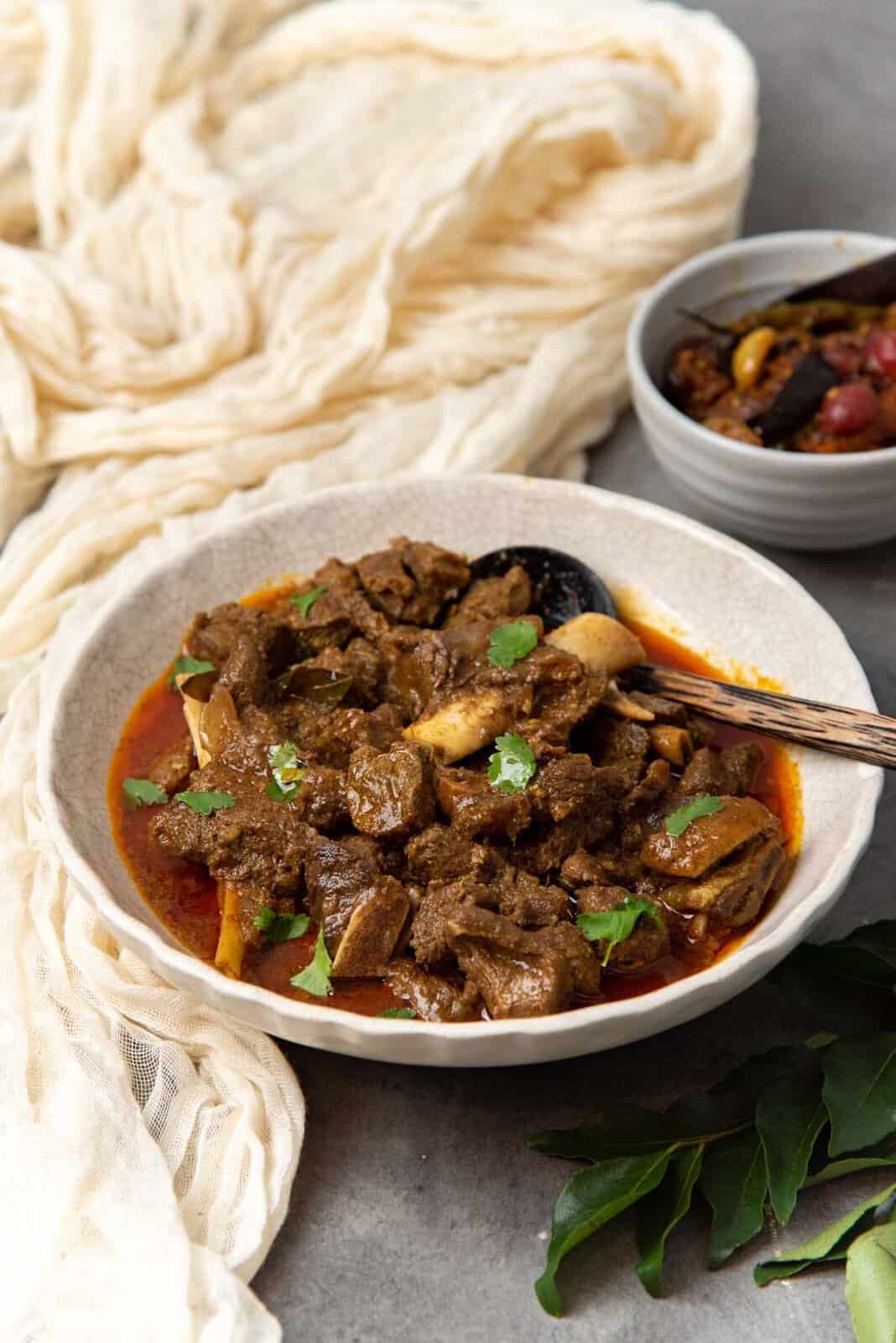 An angled view of the curry served with the gravy.