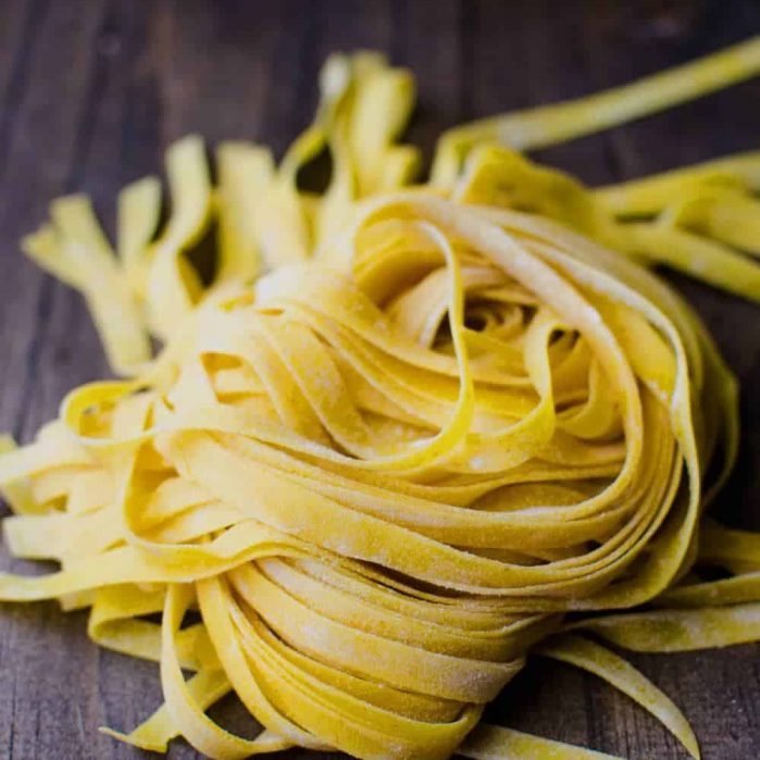 Homemade Turmeric Pasta - Bright yellow, smoky turmeric infused into homemade pasta dough. Fun to make and gives your pasta a delicious smoky flavor with a pleasant, slight bitterness.