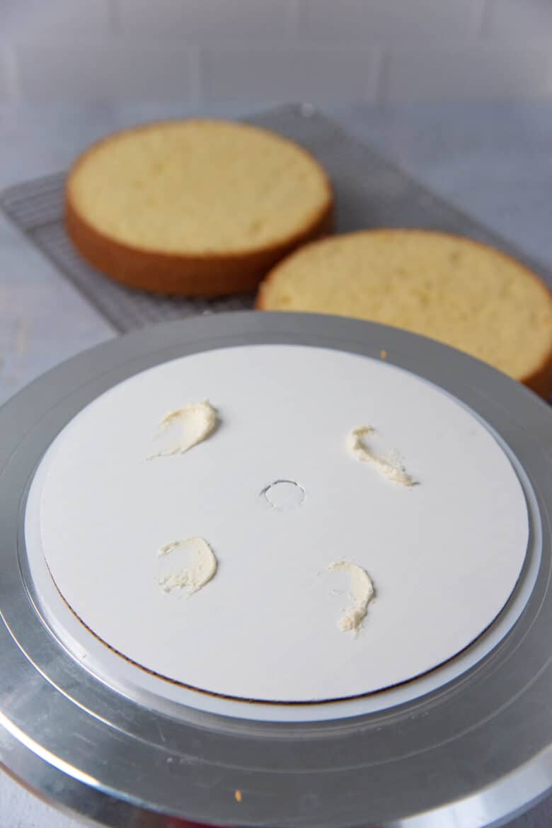 A cake board on a cake stand
