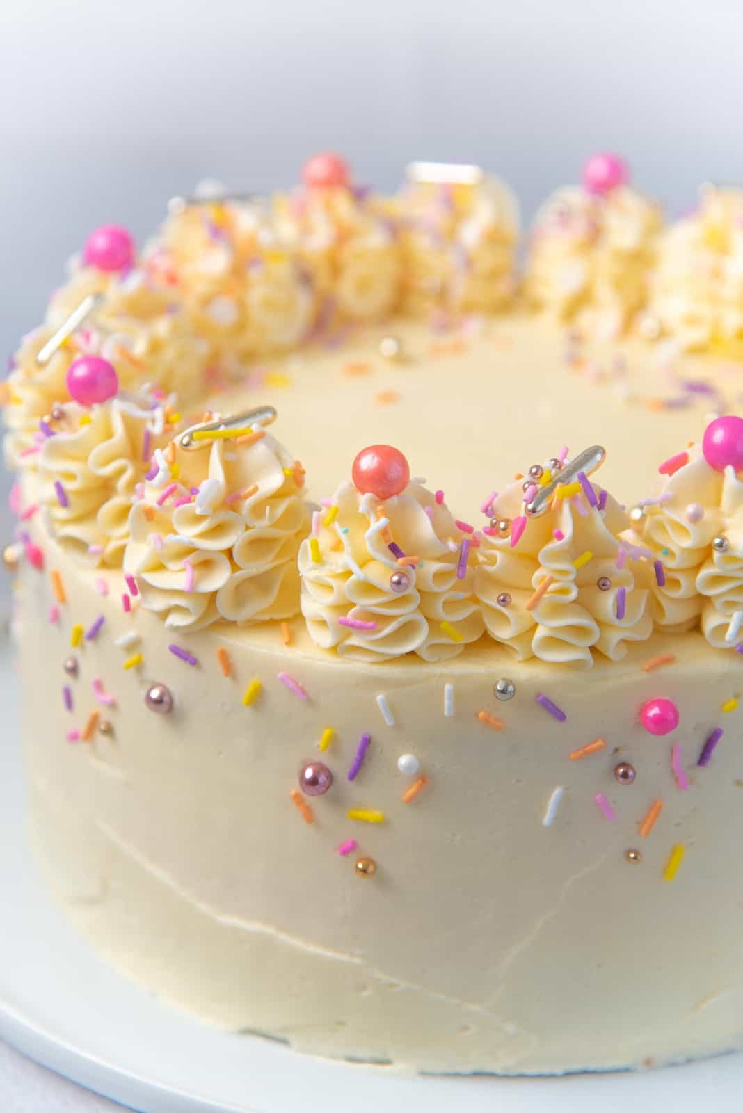 A close up of the decorative detail on the vanilla birthday cake