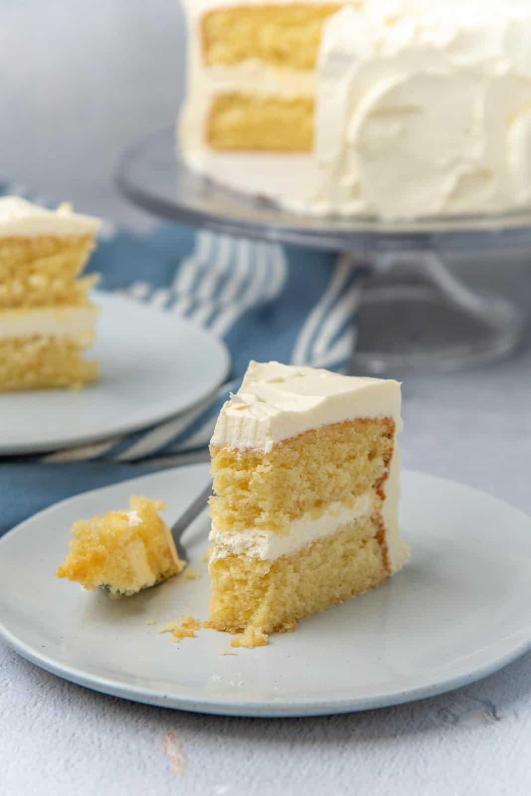A piece of the vanilla cake taken out to show the crumb of the cake