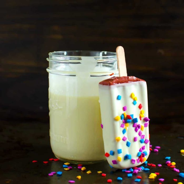 White Chocolate Magic Shell Sauce - Two ingredients, and one minute are all you need to make this easy White Chocolate Magic Shell Sauce and transform all your cold desserts with a little bit of creamy white chocolate awesomeness!